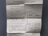 a receipt on a piece of paper hanging on a wall