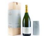 a bottle of champagne next to a box of wine