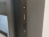 a close up of a computer monitor with a mouse on top of it