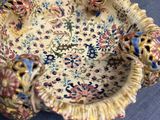 a small bowl with a decorative design on it