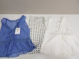 two pieces of clothing sitting on top of a table next to each other
