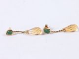 pair of gold and emerald earrings with leaves
