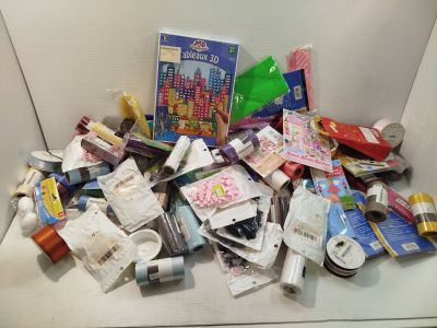 a white box filled with assorted items on a table