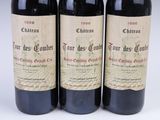 three bottles of red wine sitting next to each other on a table