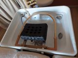 an image of a bathtub with a heater attached to it