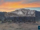 an image of a billboard with a mountain in the background