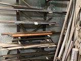 a pile of metal pipes and pipes in a room