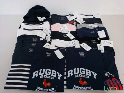 a lot of t - shirts that are on a table