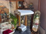 a desk with a lamp and a chair in a room