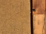 a wooden object with a tag on it sitting on a table