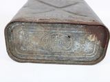 an old metal box with a metal lid on a white surface