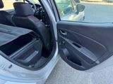 a car with its door open on the side of the road