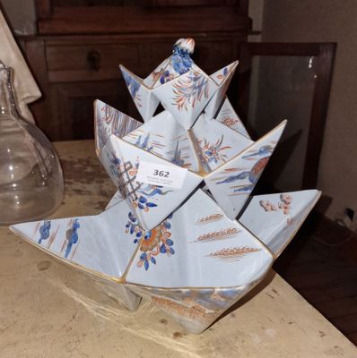 a paper boat that is sitting on a table