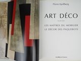 an open book with a picture of art deco on it