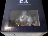 a box that has a silver object inside of it