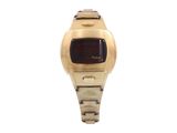 an image of a gold watch with a red face