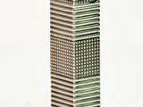 an image of a miniature clock tower on a white surface