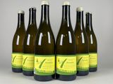six bottles of wine are lined up in a row