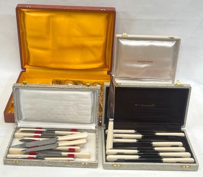 several different types of knives are in a case on a table