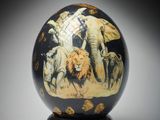 a black ball with a picture of animals painted on it