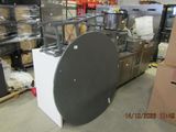 a large black and white object in the middle of a room
