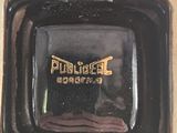 a picture of a black and gold plate with a name on it