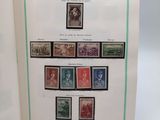 an open book with a bunch of stamps on it