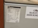 an image of a refrigerator with a price label on it
