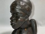 sculpture of a woman ' s head with a turban on it ' s head