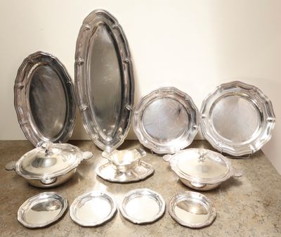a lot of silver plates on the table