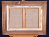 painting on easel with canvas and wooden frame on black background