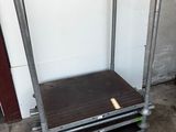an image of a metal shelf with a wooden top