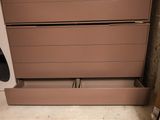 two drawers that are open on the floor
