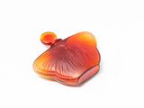 a red and orange piece of glass on a white surface