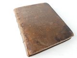an old book that is sitting on a table