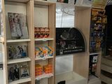 many shelves with pictures on them in a store