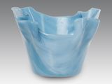 an image of a blue glass bowl on a gray background