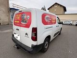 a white van that is parked in a parking lot