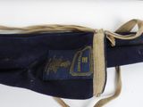 a blue bag with a label on it that is tied to a string