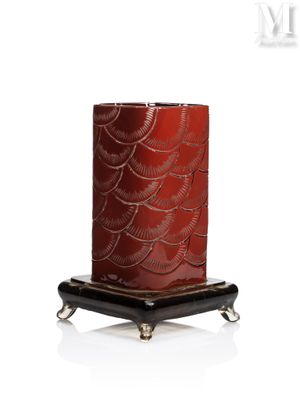an image of a red candle with a black base on a white background