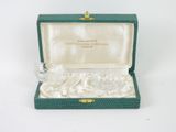 a small box with a glass figurine inside of it