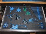 a drawer full of tools that are sitting on a table