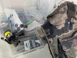 a bag with a fishing rod, reel, and other fishing gear