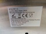 a label on the back of a stainless steel refrigerator