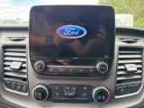 a close up of the dashboard of a car with the ford logo on it