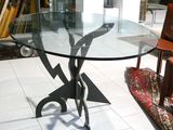 a glass table with a bird design on it