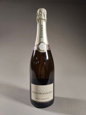 a close up of a bottle of champagne on a table