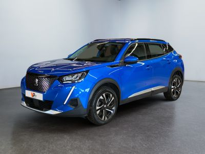 a blue suv parked in a room with a white wall
