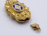 an image of a gold and blue broochle with a gold clasp