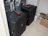 three suitcases that are sitting in the corner of a room